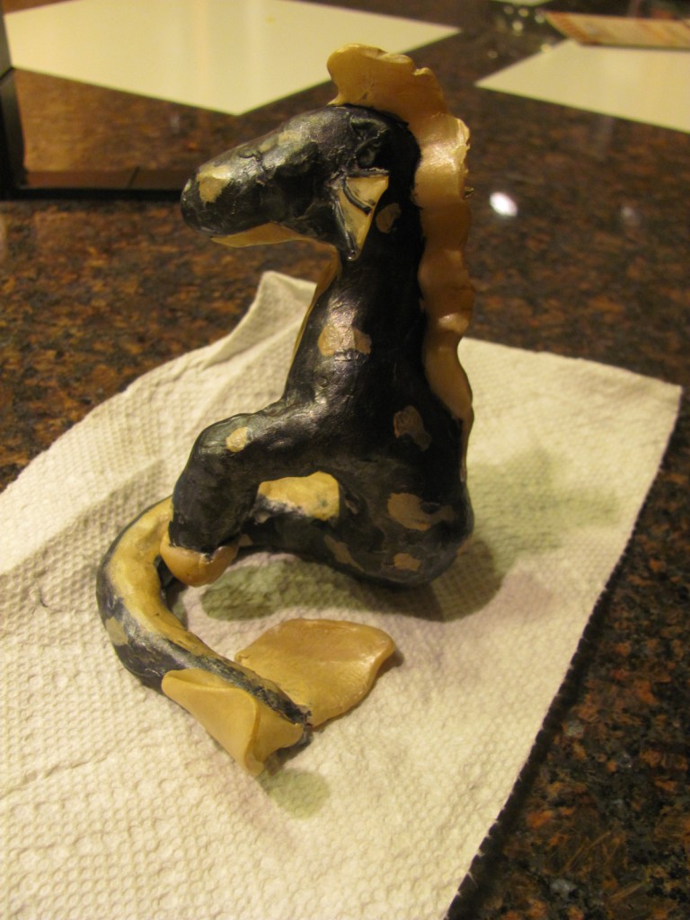 Side view of the polymer clay horse-fishey statuette I made