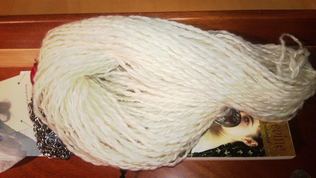 55 yards of undyed, plied, spun wool.