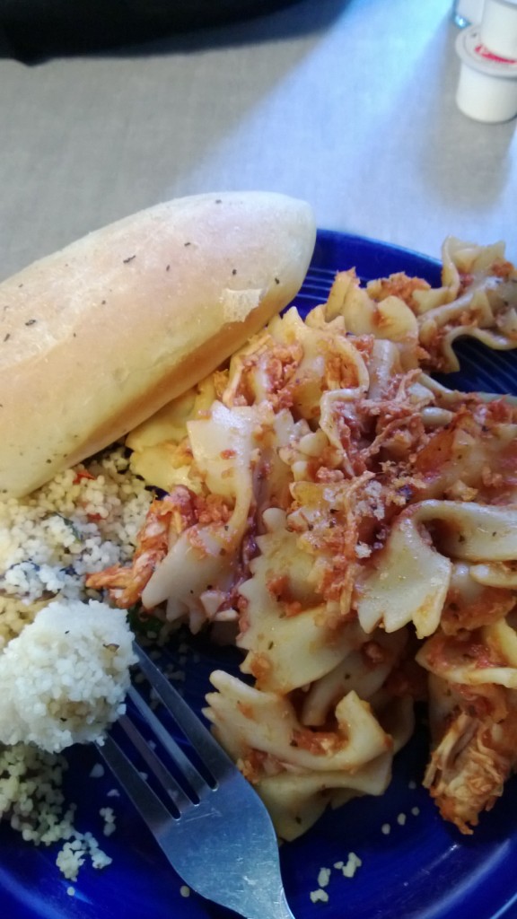 a meal served by the dining service- couscous, pasta, and bread.