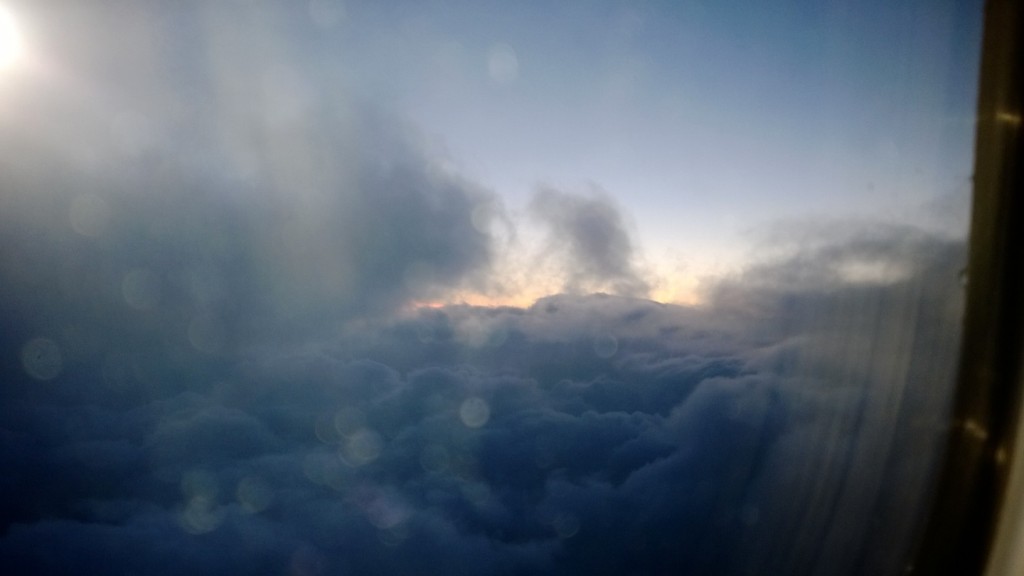 Blueish clouds against a sunset backdrop- top view of the clouds