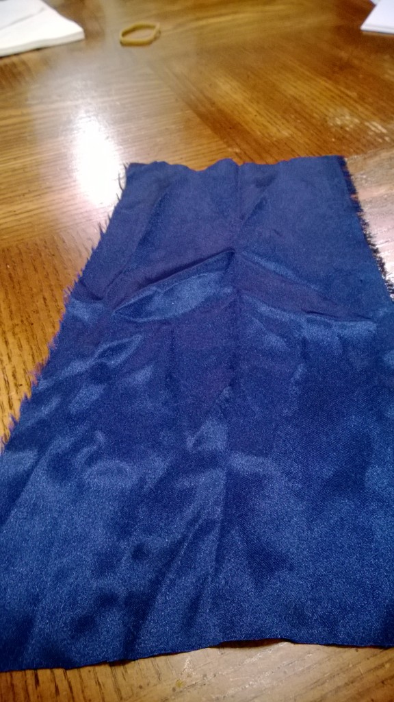 A length of blue satin fabric to make a banner
