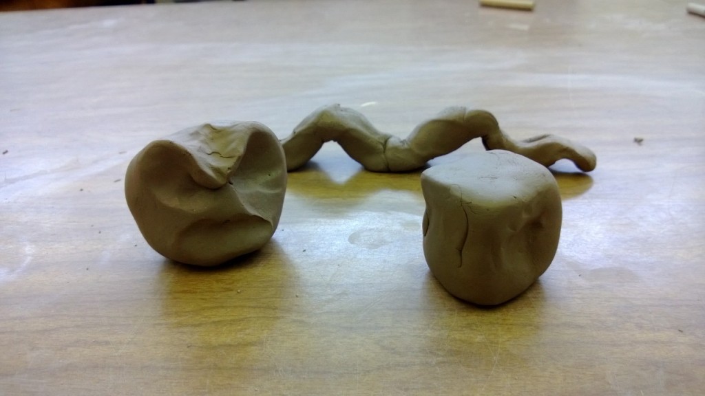 Three clay figures symblifying anger, melodious, and strength
