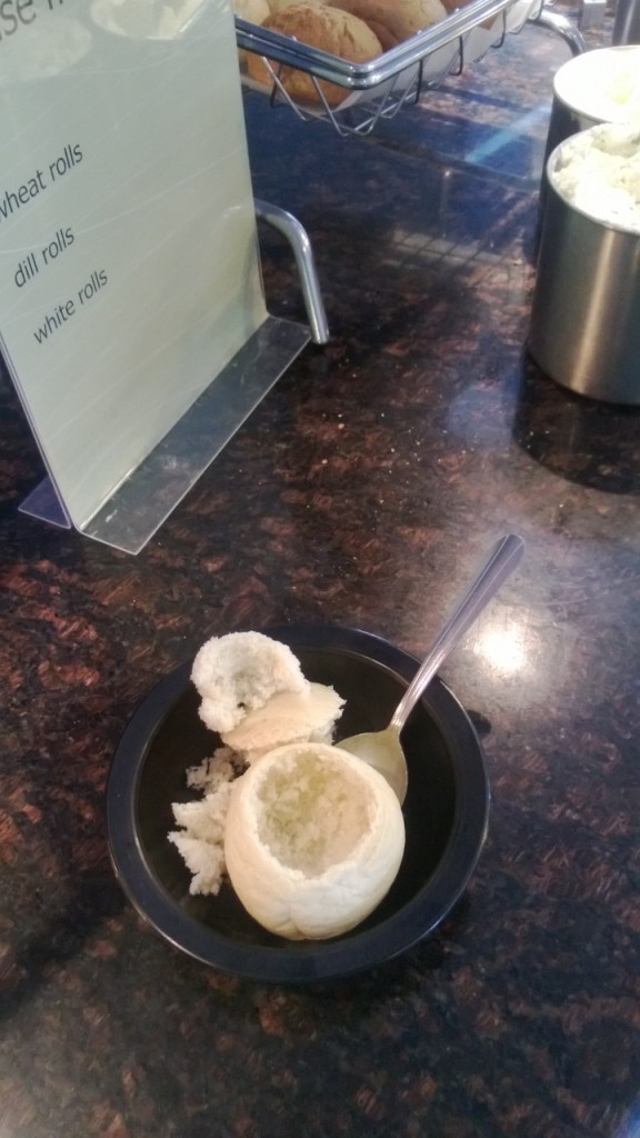 Formation of a breadbowl from a dinner roll.