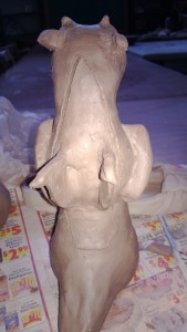 A ceramic dragon with slightly stocky tail