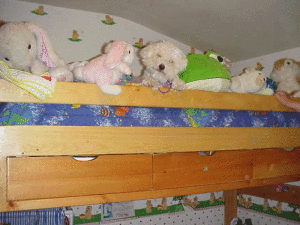 A blinking frog pillow with a puppy