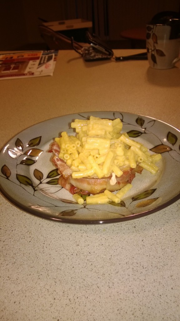 Kraft Macaroni & Cheese in a bowl made of bacon. On a pretty floral plate.