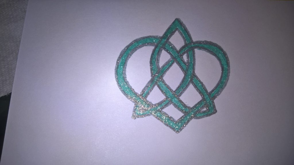 Celtic trinity and heart knot in sparkly green